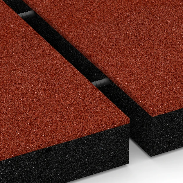 Großaufnahme vom Verbindungssystem von WARCO-Boden 6272 - Fallschutzplatte – 230 cm im Farbdesign Ziegelrot. Abmessungen 50 x 50 x 8 cm.