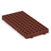 Foto der hinteren Seite vom unsymmetrischen WARCO-Formteil 6119: Fallschutz-Rasengittermatte, Design Ziegelrot, Maße 100 × 50 × 8 cm.